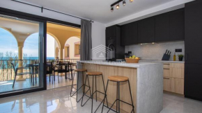 Contemporary loft style apartment with amazing sea views and with direct access to the beach from the community